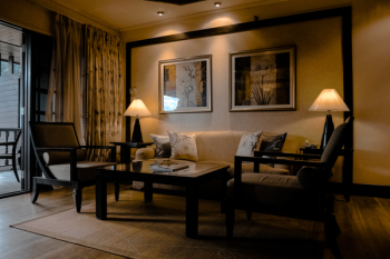 Brown Wooden Sofa Set With Lighted Table Lamp