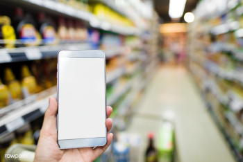 Browsing phone in supermarket | Free stock photo - 71456 Browsing phone in supermarket | Free stock photo - 71456
