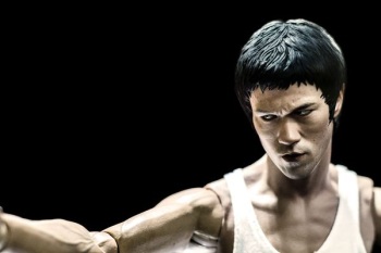 Bruce Lee action figure with black background Bruce Lee action figure with black background