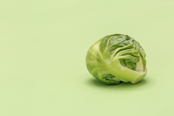Brussel Sprout On Green Surface Brussel Sprout On Green Surface