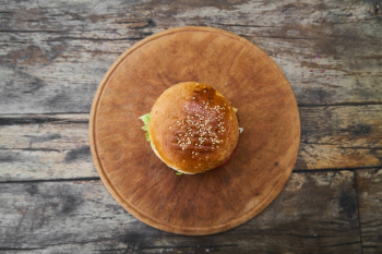 Burger On Round Wooden Tray Burger On Round Wooden Tray