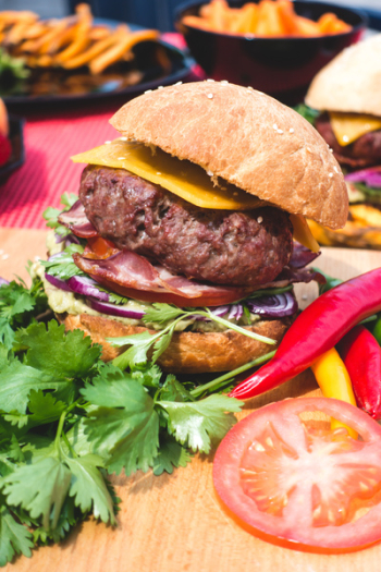 Burger with cheddar, bacon and guacamole Burger with cheddar, bacon and guacamole