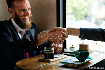 Business agreement handshake at coffee shop Business agreement handshake at coffee shop