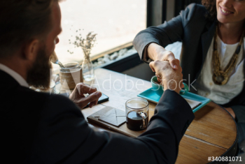 Business agreement handshake at coffee shop Business agreement handshake at coffee shop