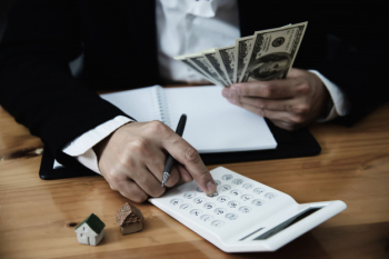 Business man show money bank note make financial plan invite people to sell or buy house and car - monetary properties loan credit insurance concept Free Photo