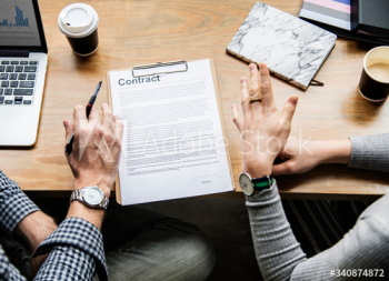 Business people discussing a contract Business people discussing a contract