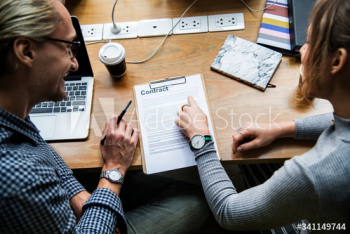Business people discussing a contract Business people discussing a contract