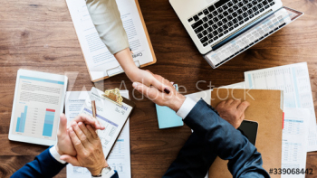 Business people shaking their hands Business people shaking their hands