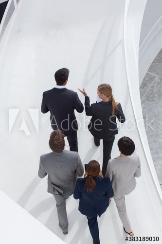 Business people walking on ramp Business people walking on ramp