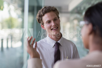 Businessman listening to colleague in office Businessman listening to colleague in office