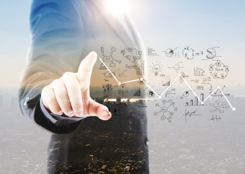 Businessman pointing graphs and symbols Businessman pointing graphs and symbols
