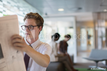 Businessman reading newspaper Businessman reading newspaper