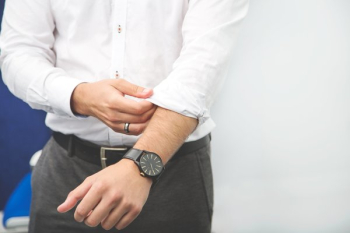 Businessman Rolls Up Sleeve Businessman Rolls Up Sleeve