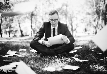 Businessman sitting with a lot of scattered p.. | Free stock photo - 428023 Businessman sitting with a lot of scattered p.. | Free stock photo - 428023