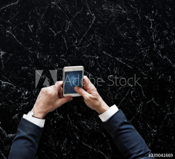 Businessman syncing data online Businessman syncing data online