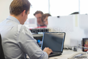 Businessman using laptop in office Businessman using laptop in office