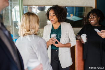 Businesswomen talking to each other Businesswomen talking to each other