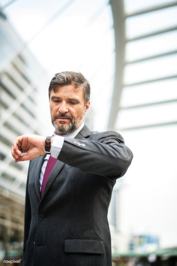 Busy businessman checking his watch | Free stock photo - 413115 Busy businessman checking his watch | Free stock photo - 413115