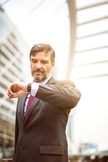 Busy businessman checking his watch | Free stock photo - 413140 Busy businessman checking his watch | Free stock photo - 413140