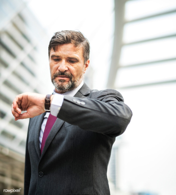 Busy businessman checking his watch | Free stock photo - 413185 Busy businessman checking his watch | Free stock photo - 413185