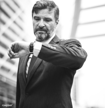 Busy businessman checking his watch | Free stock photo - 413266 Busy businessman checking his watch | Free stock photo - 413266