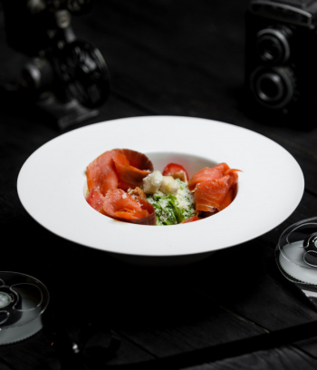 Caesar salad with smoked salmon and crackers Free Photo Caesar salad with smoked salmon and crackers Free Photo