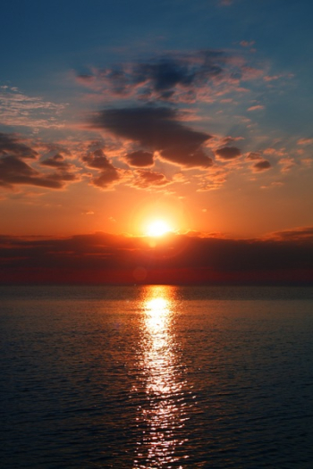 Calm Blue Sea During Golden Hour Calm Blue Sea During Golden Hour