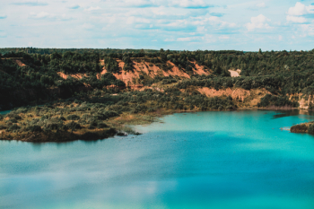 Calm Body of Water Under Blue Sky Calm Body of Water Under Blue Sky