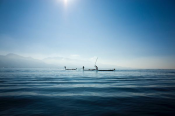 calm body water under blue sky calm body water under blue sky