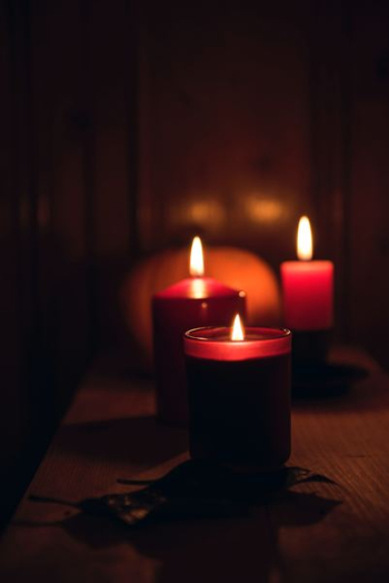 candles with fire during nighttime candles with fire during nighttime