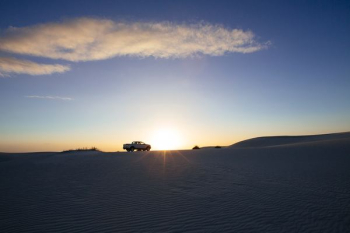 car on desert during sunset car on desert during sunset