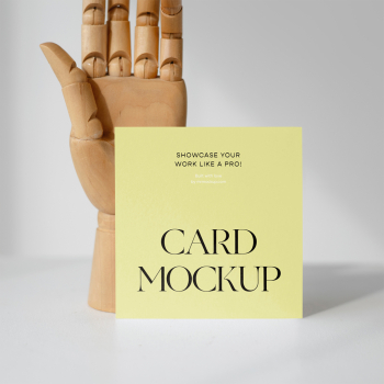Card with Wood Hand Mockup Card with Wood Hand Mockup