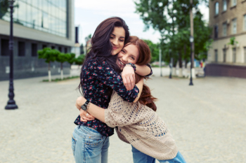 Carefree smiling sisters hugging and having fun together Free Photo Carefree smiling sisters hugging and having fun together Free Photo