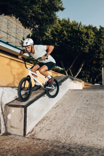 Careful man riding bicycle low angle view Free Photo