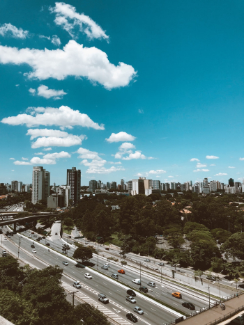 Cars Driving on Road Under Blue Sky Cars Driving on Road Under Blue Sky