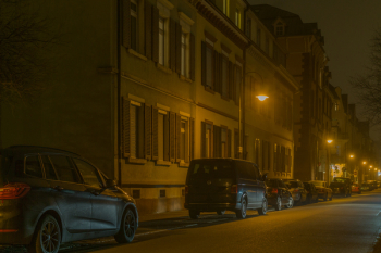 Cars in Illuminated City at Night Cars in Illuminated City at Night