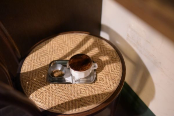 ceramic cup filled with brown liquid ceramic cup filled with brown liquid