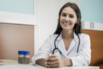 Cheerful female doctor in clinic Cheerful female doctor in clinic