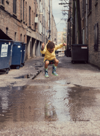 Child Jumping Into Body of Water Child Jumping Into Body of Water