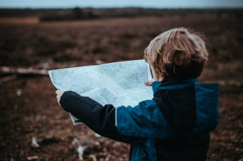 child looking at map child looking at map