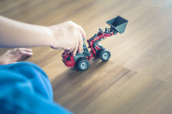 Child Playing Front Loader Toy Child Playing Front Loader Toy