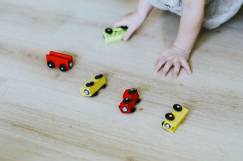 Child playing with toys on the floor Child playing with toys on the floor