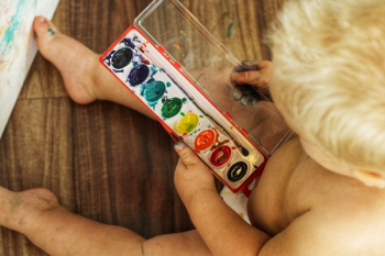 Child Playing with Water Colours Child Playing with Water Colours