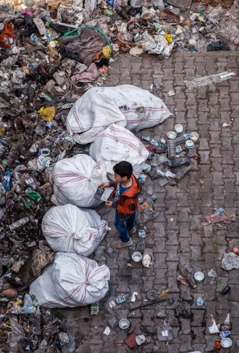 Child Standing Near Garbage Child Standing Near Garbage