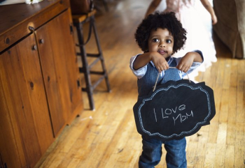 Child With I Love Mom Sign Child With I Love Mom Sign