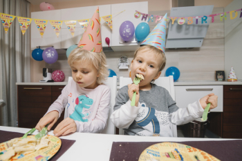 Children eating birthday cake Children eating birthday cake