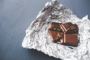 Chocolate pieces on aluminum foil Chocolate pieces on aluminum foil