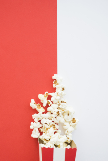Cinema concept with popcorn background Cinema concept with popcorn background