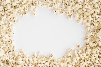 Cinema concept with popcorn background Cinema concept with popcorn background