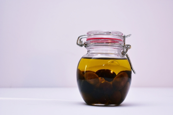 Clear Airtight Canister With Brown Liquid Clear Airtight Canister With Brown Liquid